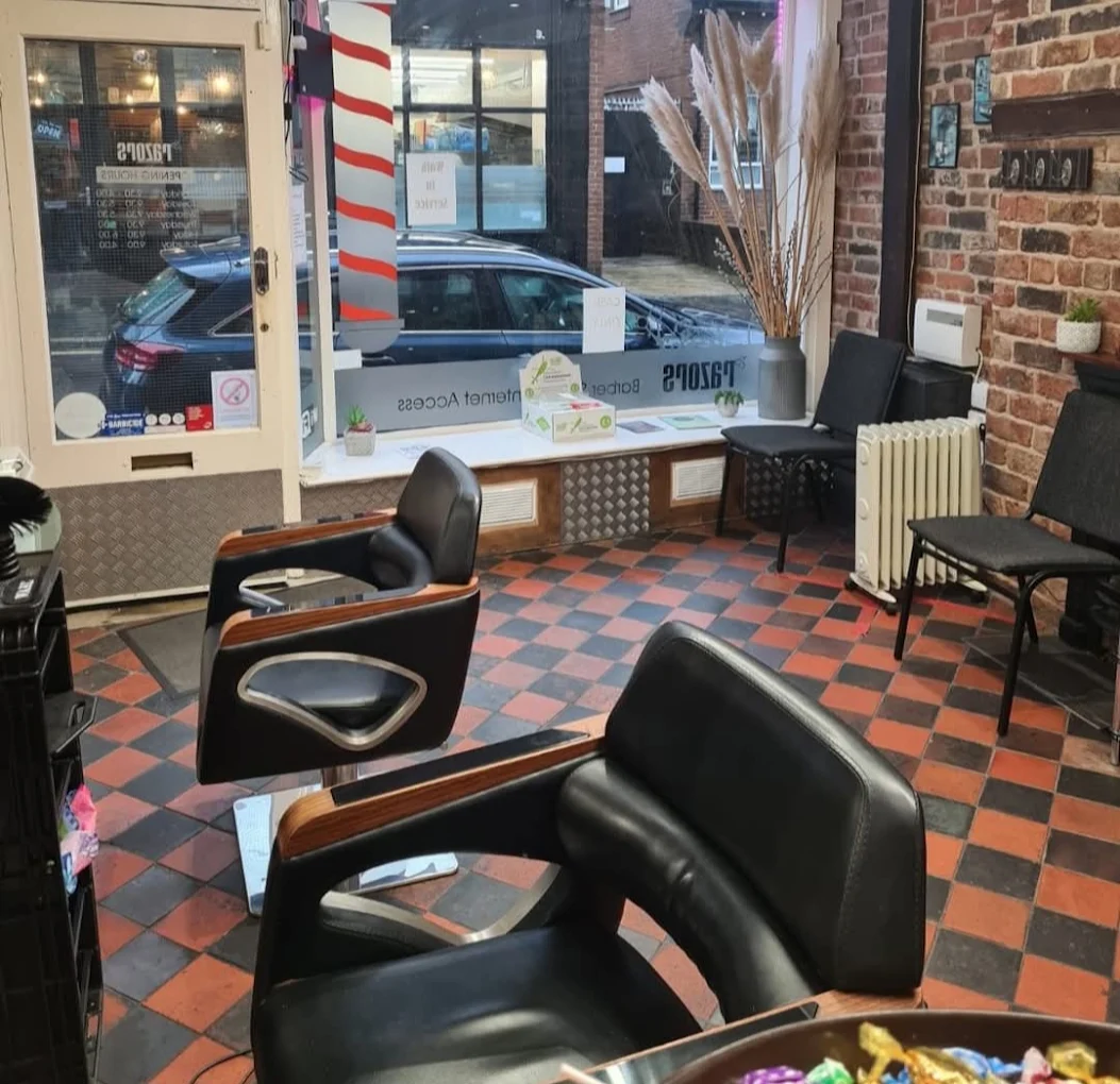 Inside Razors Barber Shop with barber chairs and the shop window